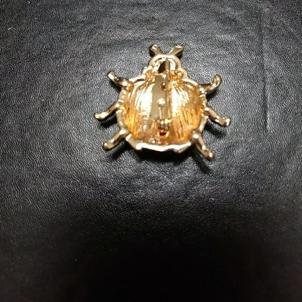 Gold tone and red enamel ladybug pin brooch